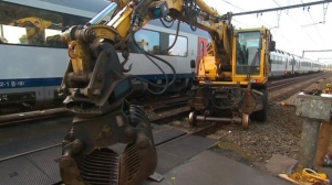 Kraanmachinist gewond na botsing met trein